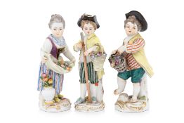 A GROUP OF THREE MEISSEN PORCELAIN FIGURES OF CHILDREN