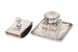 A GERMAN SILVER INKWELL ON STAND AND AN ENGLISH INK BLOTTER