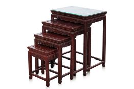 A SET OF FOUR CHINESE HARDWOOD NESTING TABLES