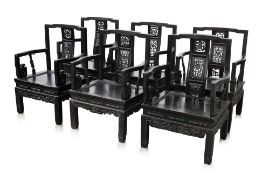 A SET OF SIX SIMILAR CHINESE CARVED HARDWOOD ARMCHAIRS