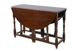 AN OAK GATELEG DROP-SIDE TABLE