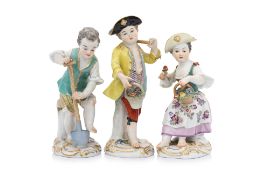 A GROUP OF THREE MEISSEN PORCELAIN FIGURES OF CHILDREN