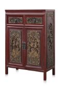 A CHINESE RED LACQUERED AND GILT CARVED WOOD CABINET