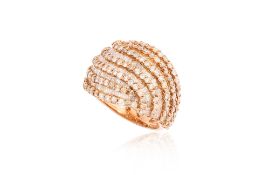 A ROUND AND TAPERED BAGUETTE CUT DIAMOND 'DOME' RING