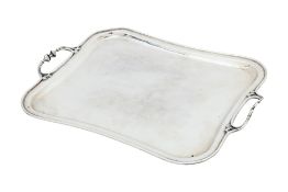 A SILVER TWIN HANDLED SERVING TRAY