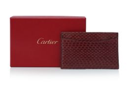 CARTIER - A BURGUNDY PYTHON LEATHER CARD HOLDER