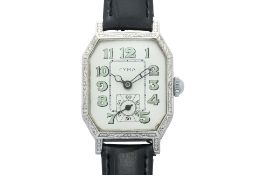 CYMA — AN ART DECO ENGRAVED RECTANGULAR WRISTWATCH