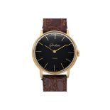 GLASHÜTTE — A SLIM GOLD PLATED BLACK DRESS WRISTWATCH