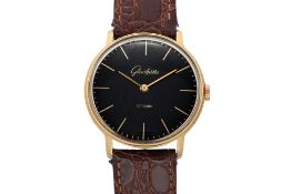 GLASHÜTTE — A SLIM GOLD PLATED BLACK DRESS WRISTWATCH