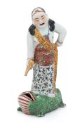 A FAMILLE ROSE PORCELAIN FIGURE OF LIU HAI