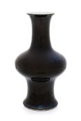 A MONOCHROME BLACK-GLAZED VASE