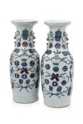 A PAIR OF LARGE CELADON GROUND FAMILLE ROSE VASES