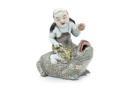A FAMILLE ROSE PORCELAIN FIGURE OF LIU HAI