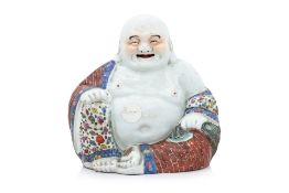 A FAMILLE ROSE FIGURE OF BUDAI