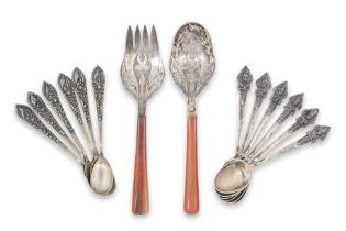 TWO SETS OF SOUTH EAST ASIAN SILVER TEASPOONS AND A PAIR OF SERVERS