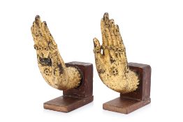 A PAIR OF SOUTH EAST ASIAN GILT-BRONZE HANDS OF BUDDHA