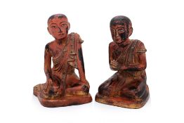 A PAIR OF BURMESE POLYCHROME MONK FIGURES