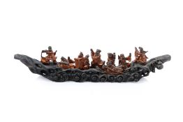 A CHINESE CARVED WOOD SCULPTURE OF EIGHT IMMORTALS CROSSING THE SEA