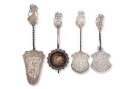 A GROUP OF FOUR INDONESIAN SILVER AND SILVER PLATED SERVING UTENSILS