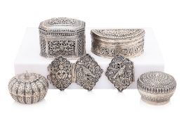 A GROUP OF FOUR SOUTH EAST ASIAN SILVER BETEL AND LIME BOXES, AND A BELT BUCKLE