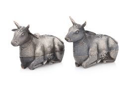 A PAIR OF CAMBODIAN COW-FORM SILVER BETEL BOXES