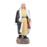A PORCELAIN FIGURE OF A MONGOL