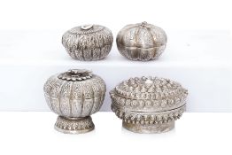 A GROUP OF FOUR BURMESE SILVER CIRCULAR BOXES AND COVERS