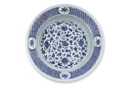 A LARGE BLUE AND WHITE FLOWER SCROLL BASIN