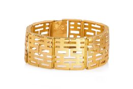 A 'DOUBLE HAPPINESS' GOLD PANEL BRACELET WITH A CHARM