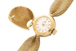 EBEL - A LADIES' 18K GOLD CONCEALED COCKTAIL WATCH