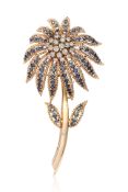 A DIAMOND AND SAPPHIRE FLORAL SPRAY BROOCH