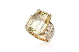 A HIGH KARAT YELLOW SAPPHIRE AND DIAMOND RING