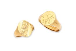 A PAIR OF CHILD'S HIGH KARAT GOLD SIGNET RINGS