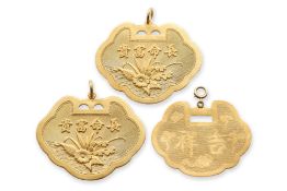 A GROUP OF THREE HIGH KARAT GOLD 'LOCK' PENDANTS