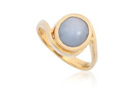 A STAR SAPPHIRE HIGH KARAT GOLD RING