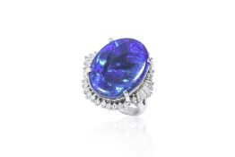 A LARGE BLACK OPAL AND DIAMOND RING
