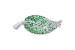 A GROSSULAR GARNET AND DIAMOND 'LEAF' BROOCH/PENDANT