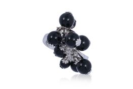 AN ONYX AND DIAMOND RING