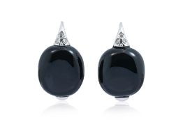 A PAIR OF ONYX AND DIAMOND HOOP EARRINGS