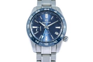 GRAND SEIKO - A STAINLESS STEEL 'SPRING DRIVE GMT' WRISTWATCH [FULL SET]