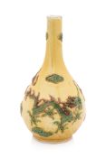 A SANCAI-GLAZED MOULDED DRAGON BOTTLE VASE
