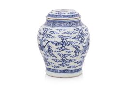 A BLUE AND WHITE CRANE DECORATED JAR AND COVER