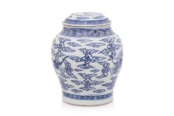 A BLUE AND WHITE CRANE DECORATED JAR AND COVER