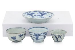 A BLUE AND WHITE TEA BOWL AND SAUCER, AND TWO TEA BOWLS