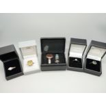 Seven silver rings, and a white metal blue stone ring, 41g total