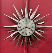 A Metamec sunburst wall clock