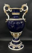 A large continental twin handle urn vase, cobalt blue ground with gilt acanthus leaf design, 59cm