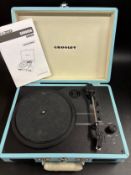 A Crosley portable record player, in a blue case