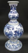 An 18th Century early Delft Dutch blue and white hand painted tin glazed vase, 26cm h