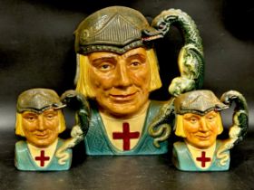 A large Royal Doulton St George character jug D6618, and two medium sized St George jugs, largest